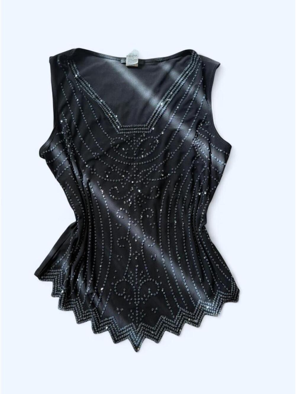 Black sparkly top with silver rhinestones and a peplum hem.